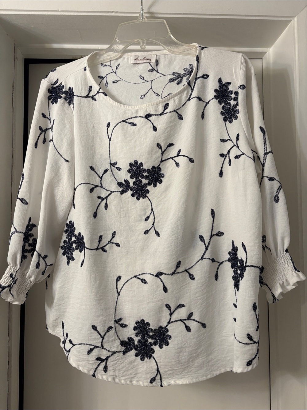 Embroidered White Blouse with Navy Floral Stitching -